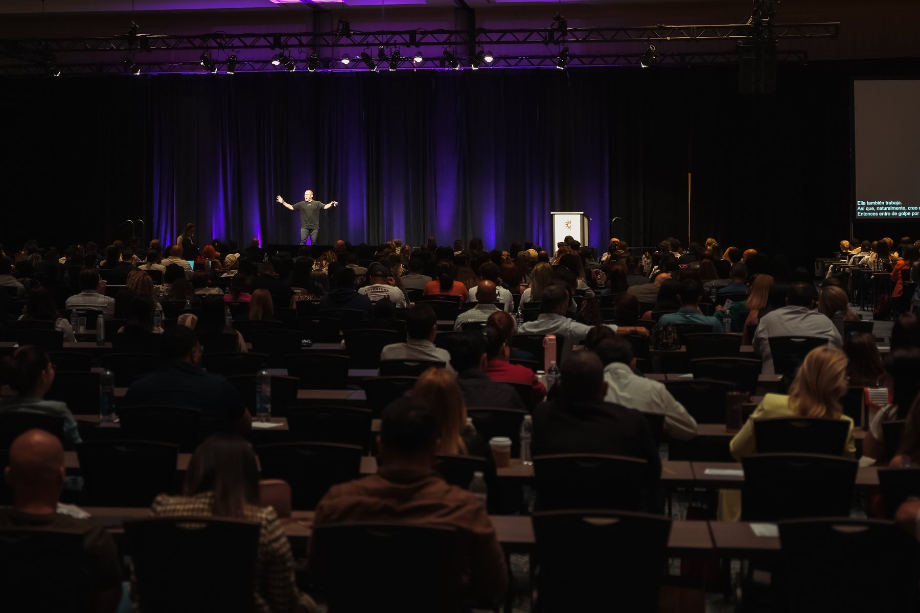 Drew Carrell on stage, wide shot